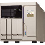 A dynamic setup showcasing the QNAP TS-677 NAS system, prominently featuring its robust AMD Ryzen processor and expanded 64GB RAM configuration. The image captures the essence of high-tech innovation and scalability, with PCIe expansion slots visible, hinting at future upgrades. Surrounding the NAS are accessories symbolizing its versatile connectivity options and the QTS operating system interface on a monitor, highlighting its user-friendly, efficient management capabilities. This visual representation emphasizes the QNAP TS-677 as not just a storage solution but a central hub for tech enthusiasts looking to explore and expand their digital horizons.